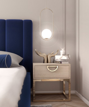 Sypialnia z tapicerowanym, granatowym łóżkiem