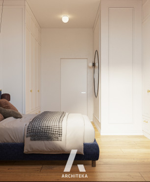 Sypialnia z granatowym, tapicerowanym łóżkiem kontynentalnym oraz toaletką