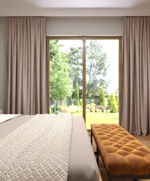 Sypialnia z szarymi, tapicerowanymi panelami na ścianie