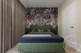 Projekt sypialni z zielonym łóżkiem, tapicerowanym kontynentalnym