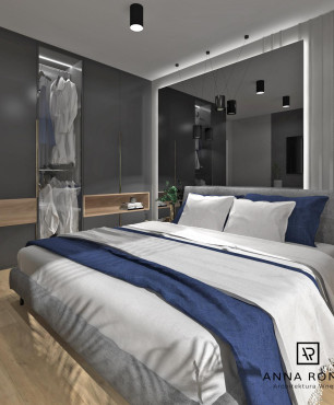 Sypialnia z przeszkloną, dużą szafą i łóżkiem tapicerowanym