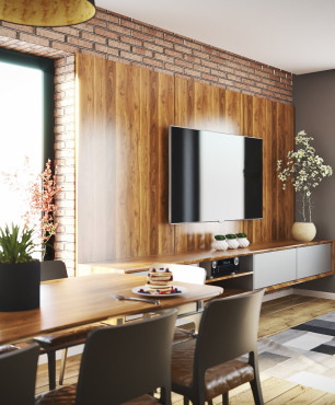 Jadalnia połączona z salonem z drewnem i cegłą na ścianie