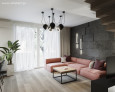 Nowoczesny salon z nutą stylu industrialnego ze stylową kanapą w oryginalnym brzoskwiniowym kolorze