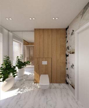 Łazienka z białą muszlą wiszącą oraz płytkami na ścianie z imitacją drewna