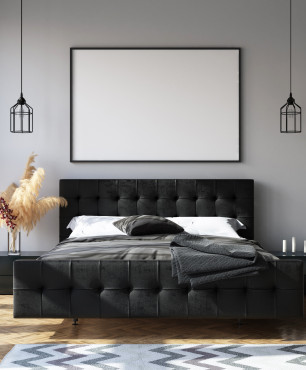 Duże, czarne, tapicerowane łóżko