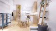 Niewielki salon w kolorze białym z drewnianymi meblami