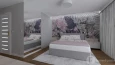 Sypialnia z szarym łóżkiem tapicerowanym kontynentalnym