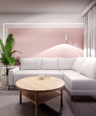 Salon z różową tapetą na ścianie